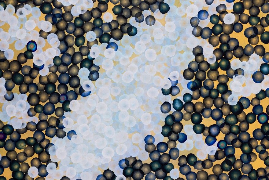 A painting showing small dot-like objects under and above water. 