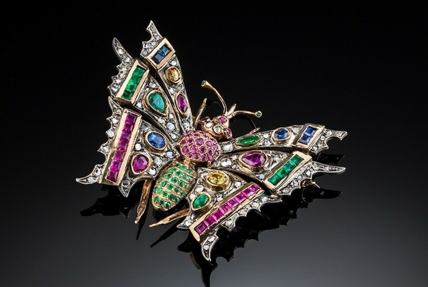 Butterfly brooch made of multicoloured precious stones.
