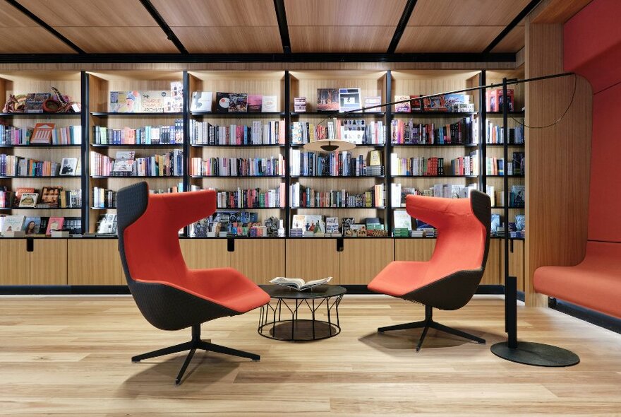 Bookstore with two large red chairs.