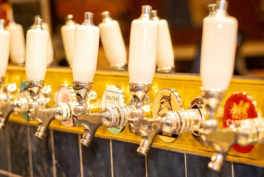 Row of beer taps.
